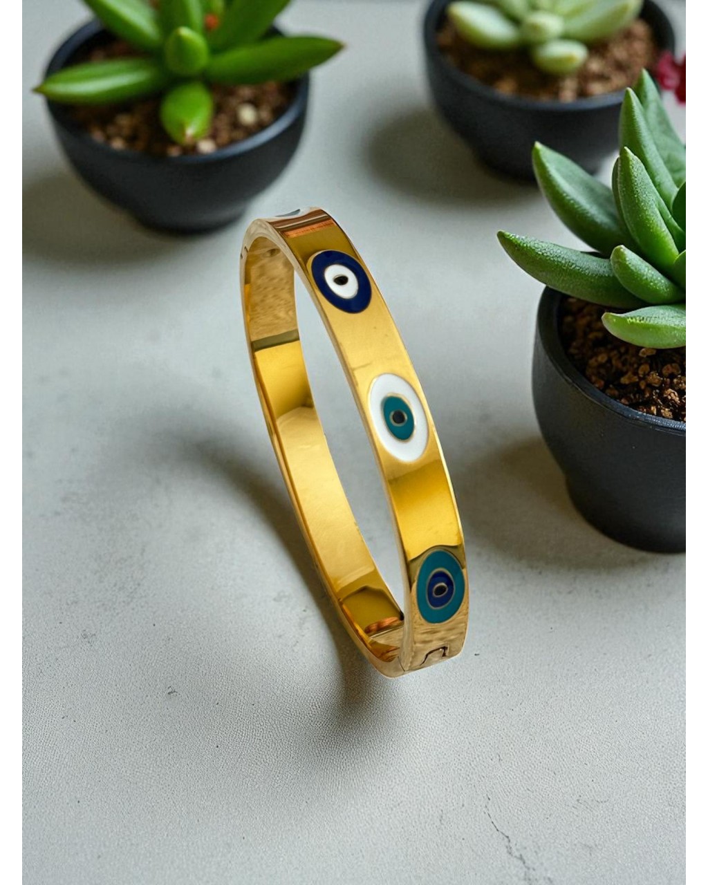 GOLD RENK NAZAR MODEL ÇELİK KELEPÇE BİLEKLİK