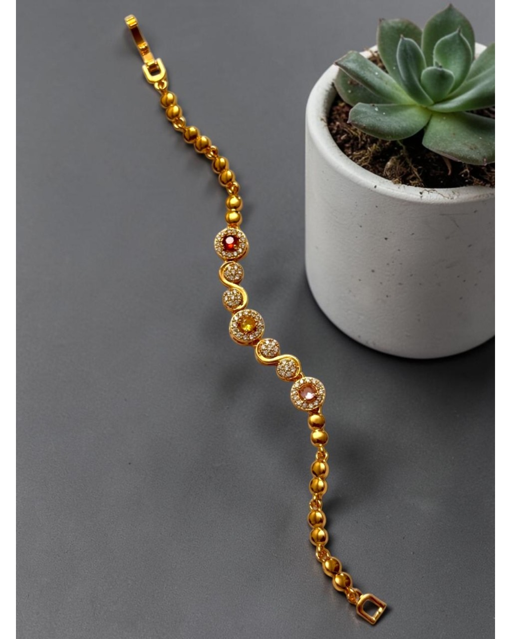 GOLD RENK YUVARLAK RENKLİ TAŞ VE SONSUZLUK MODEL ZİRKON TAŞLI XUPING BİLEKLİK