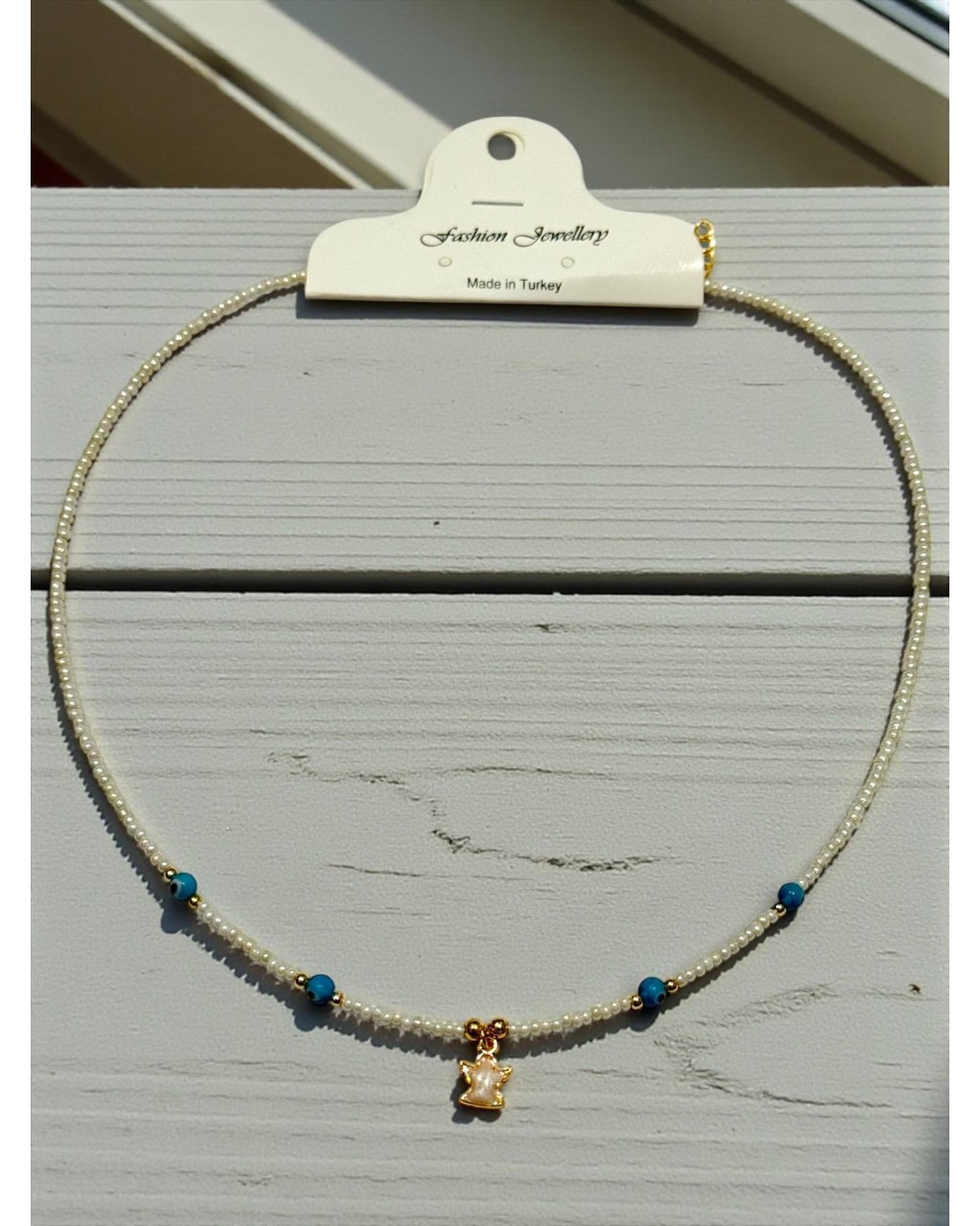 MİNELİ MELEK MODEL NAZARLI BEYAZ ÇELİK TELLİ KUM KOLYE