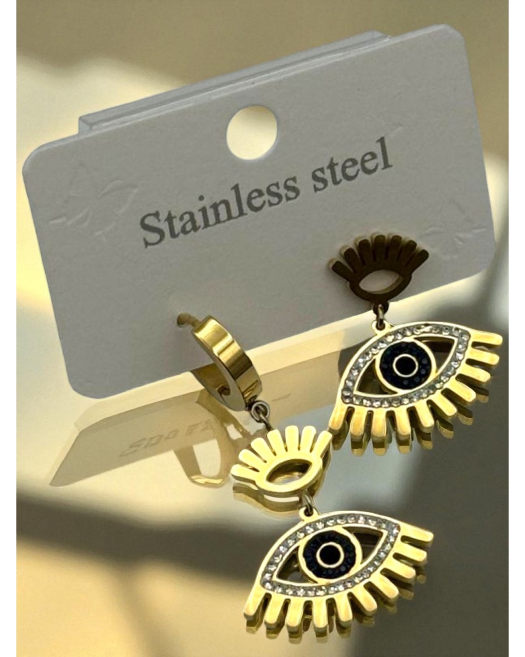 GOLD RENK ZİRKON TAŞLI GÖZ MODEL SALLANTILI ÇELİK KÜPE